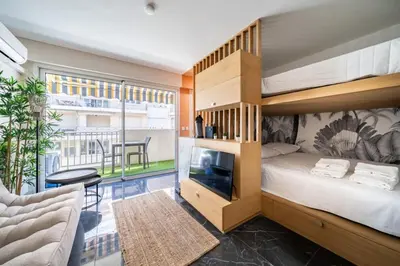 a bedroom with a bunk bed and a balcony at Sublime studio in the center of Cannes in Cannes