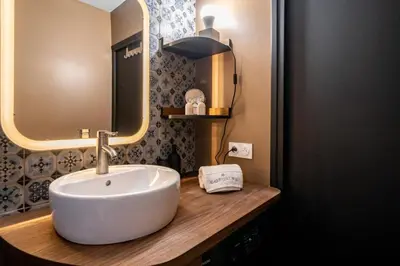a bathroom with a sink and a mirror at Sublime studio in the center of Cannes in Cannes