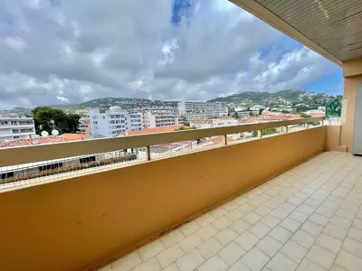 a balcony with a view of a city at Astoria luxury apartment- 3 bathrooms in Cannes