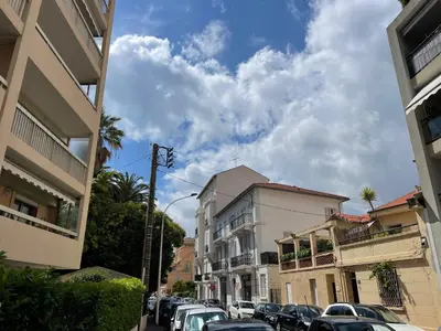 a city street with cars parked in a parking lot at Astoria luxury apartment- 3 bathrooms in Cannes