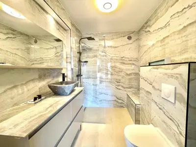a bathroom with a sink and a toilet at Astoria luxury apartment- 3 bathrooms in Cannes