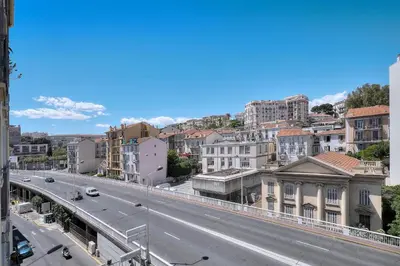 a view of a city with a road and buildings at Le Eve- 350M mer- 600 Palais-VCA in Cannes