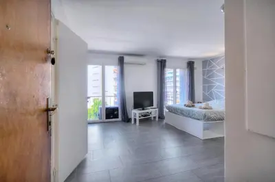 a bedroom with a bed and a television in it at Le Eve- 350M mer- 600 Palais-VCA in Cannes