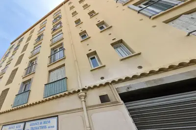 a tall building with windows on the side of it at Le Eve- 350M mer- 600 Palais-VCA in Cannes