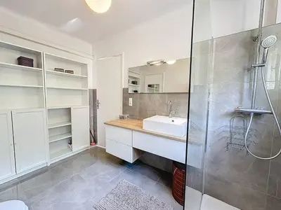 a bedroom with a bed and a large window at MIA2 - 3 pièces avec terrasse in Cannes