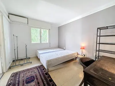 a bedroom with a bed and a window at MIA2 - 3 pièces avec terrasse in Cannes