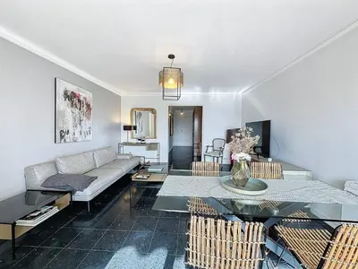 a large kitchen with blue cabinets and appliances at MIA2 - 3 pièces avec terrasse in Cannes
