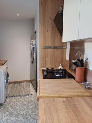 a kitchen with a stove and a refrigerator at Charmant 3pièces près de Cannes in Le Cannet