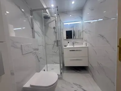 a bathroom with a shower and a toilet and a sink at Cannes Garden Suquet, Terrasse & Garage in Cannes