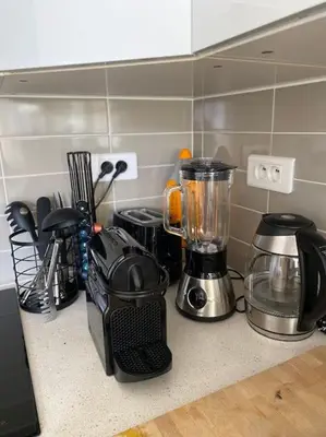 a kitchen counter with a blender on a counter top at Cannes banane, T2 centre ville, 400 m des plages in Cannes