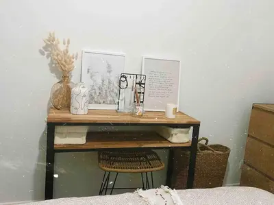 a small wooden table with a chair in a room at Cannes banane, T2 centre ville, 400 m des plages in Cannes