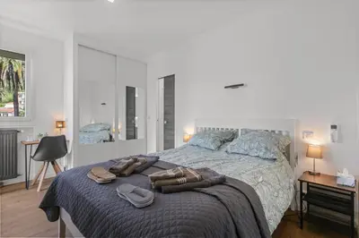a bedroom with a bed with towels on it at Cannes Sea View, by Beach, Private Room in Shared 3-Bedroom Apartment, Private Bathroom & Balcony,, Chambre avec salle de bain privative & balcon, chez l'habitant in Cannes