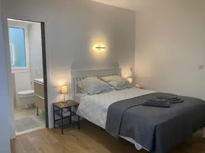 a bedroom with a bed and a bathroom with a toilet at Cannes Sea View, by Beach, Private Room in Shared 3-Bedroom Apartment, Private Bathroom & Balcony,, Chambre avec salle de bain privative & balcon, chez l'habitant in Cannes