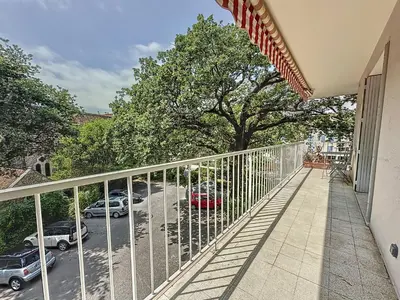 a balcony with a view of a parking lot at 63m2 Grande Terrasse, Clim in Cannes