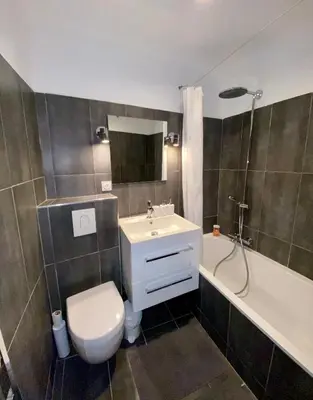 a bathroom with a sink and a toilet and a tub at Appartamento coeur du Suquet in Cannes
