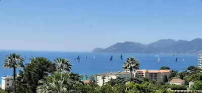 a view of the ocean with sailboats in the water at Le Paradis d'Ella in Cannes