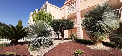 a building with palm trees in front of it at Le Paradis d'Ella in Cannes