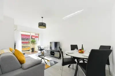 a living room with a couch and a table at Apartment with Terrace walk to Beaches & Shopping in Cannes