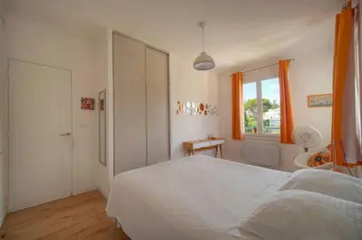 a bathroom with a sink and a mirror and a toilet at FRGK Isola Bella ' Appartement Confortable' in Cannes