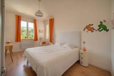 a table and two chairs on a balcony at FRGK Isola Bella ' Appartement Confortable' in Cannes