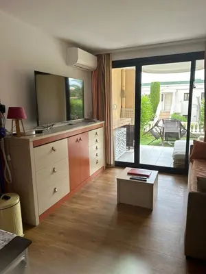a living room with a dresser and a mirror at Villa Francia Résidence piscine tennis à 500m des plages de Cannes in Cannes