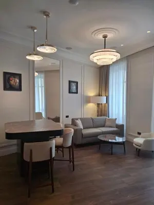a living room with a couch and a table at Apartments in the old town in Cannes