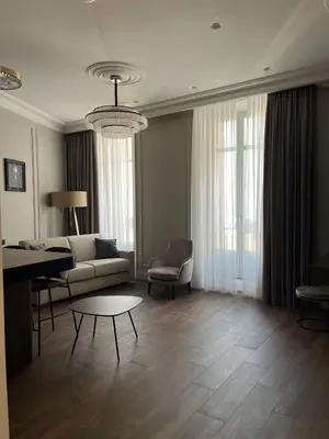 a living room with a couch and a table at Apartments in the old town in Cannes