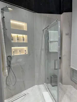 a bathroom with a shower with a glass at Apartments in the old town in Cannes