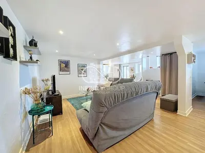 a living room with a couch and a table at Grand 2p Proche Palais - Boulevard Delaup Cannes in Cannes