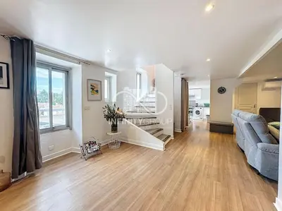 a bedroom with a bed in a white room at Grand 2p Proche Palais - Boulevard Delaup Cannes in Cannes