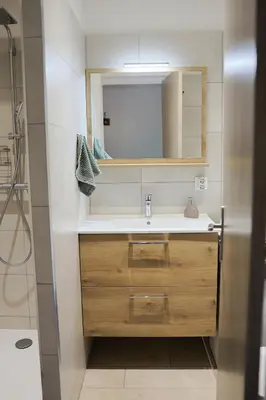 a bathroom with a sink and a mirror at Appartement à 10min à pied Palais Festivals in Cannes
