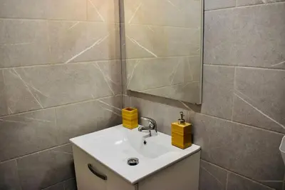 a bathroom with a sink and a mirror at Studio bord de mer in Cannes