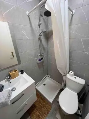 a bathroom with a toilet and a sink and a shower at Studio bord de mer in Cannes