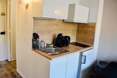a kitchen with a sink and a counter top at Studio bord de mer in Cannes