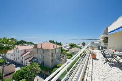 a view from the balcony of a house at Cozy top-floor 2-Br apartment terrace and sea view in Cannes