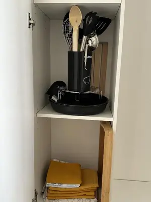 a shelf with a pot and utensils on it at Super Apartment, Parking, Terrace, Lift, WIFI, Palm Beach, Cannes in Cannes