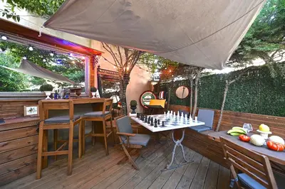 a patio with a chess board on a table at Cité Saint Paul Terrasse Parking Clim Wifi Sauna in Cannes
