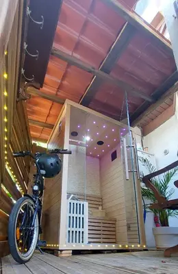 a bike parked in a room with a building at Cité Saint Paul Terrasse Parking Clim Wifi Sauna in Cannes