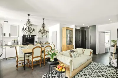 a living room with a couch and a table at Immogroom - T4 - Center - 8 min from Palais in Cannes