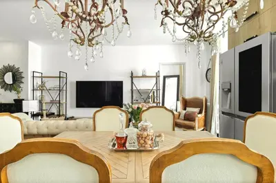 a dining room with a table and chairs at Immogroom - T4 - Center - 8 min from Palais in Cannes