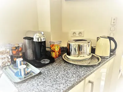 a kitchen counter with a coffee maker and a toaster at Elegant studio a 50m de la Croisette et ses plages - Ada Serenity Beach in Cannes