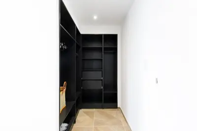 a hallway with black shelves in a room at Carlton area lux 2 beds 2 baths in Cannes
