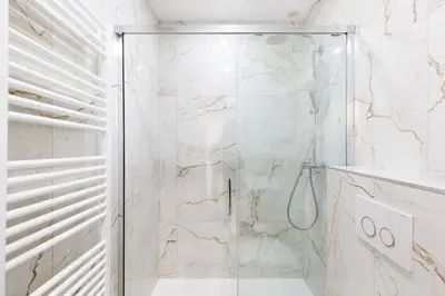 a shower with a glass door in a bathroom at Carlton area lux 2 beds 2 baths in Cannes