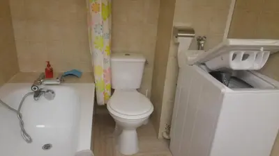 a small bathroom with a toilet and a sink at Gautier Jean in Cannes
