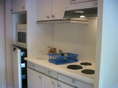 a small kitchen with a sink and a stove at Gautier Jean in Cannes