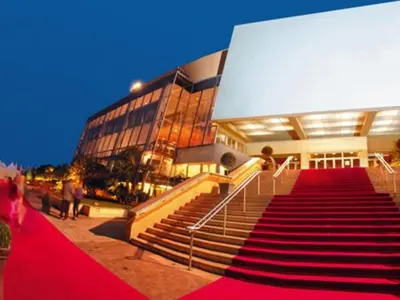 a red carpeted staircase in front of a building at Studio Cannes Carré d'Or in Cannes