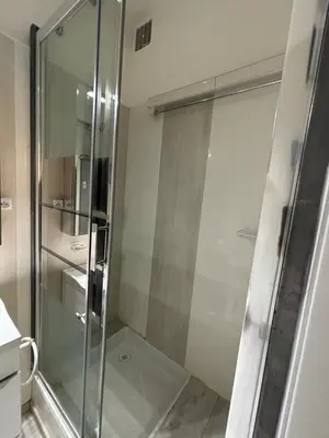 a shower with a glass door in a bathroom at Studio Cannes Carré d'Or in Cannes