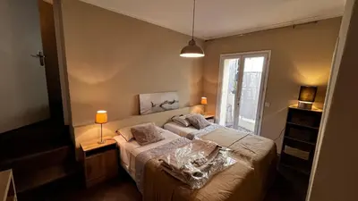 a bedroom with a bed and a window at Maison CENTRE CANNES 2 CHAMBRES 4 COUCHAGES in Cannes