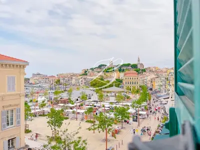 a view of a city with people walking on a street at Le Félix Faure - Palais Centre Cannes in Cannes