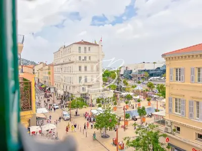 a view of a city street with people and buildings at Le Félix Faure - Palais Centre Cannes in Cannes